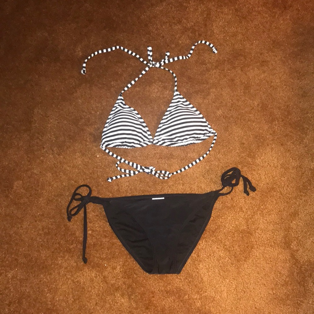 Striped bikini top and black bikini bottom